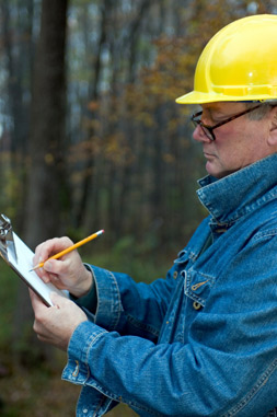 Roofing contractor checking a list